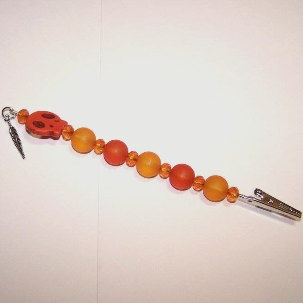Orange skull and feather bracelet helper